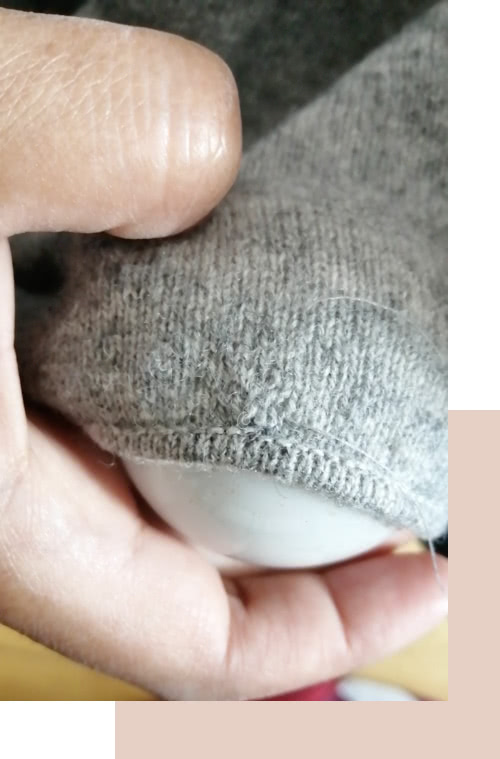 réparer trou de mite pull